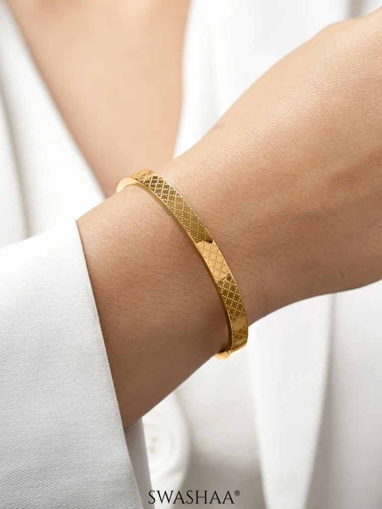 Elegant 18k gold bracelet with a white a silk outfit