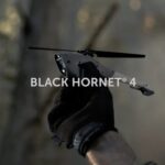 Black hornet 4 military uav drone taking a flight in the woods