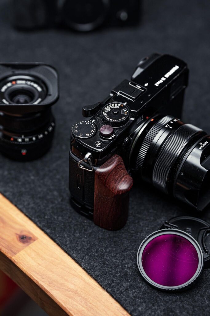 Fujifilm X-Pro4 tactile rangefinder digital camera with X-Trans VII sensor and silver retro body design for professional street photography.