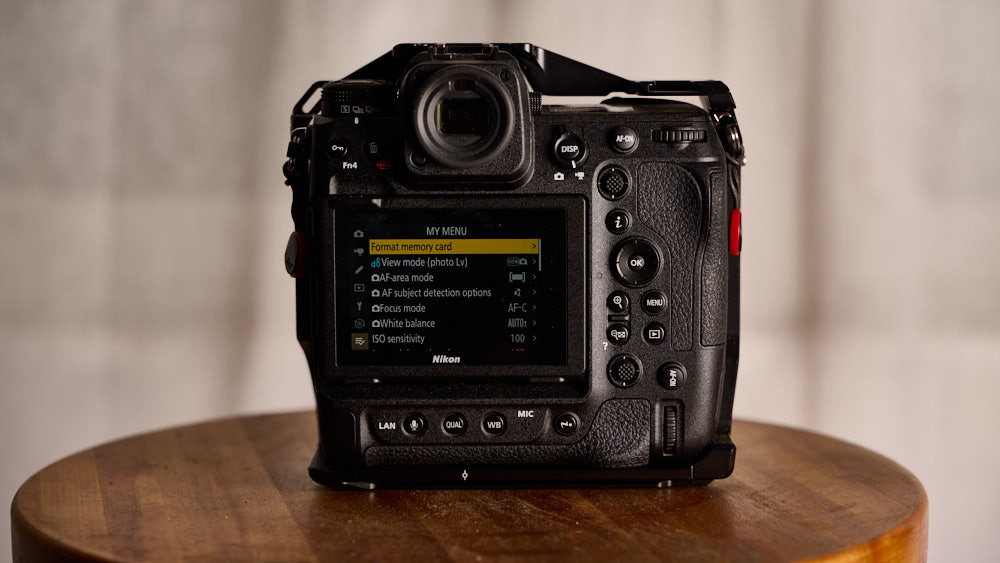 Nikon Z9 II professional flagship mirrorless camera with Expeed 8 processor shown against a snowy mountain backdrop for wildlife and adventure photography.