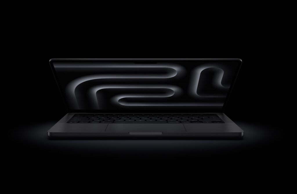 apple macbook pro M5 laptop in black color in black background as the best 2026 laptop.