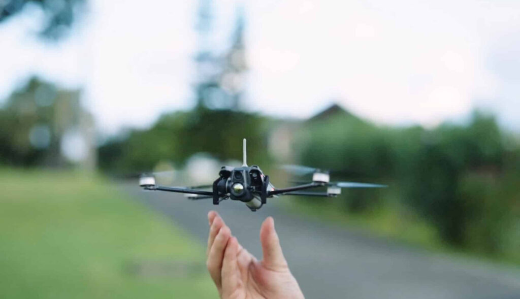 Nano drone taking a flight from a hand 