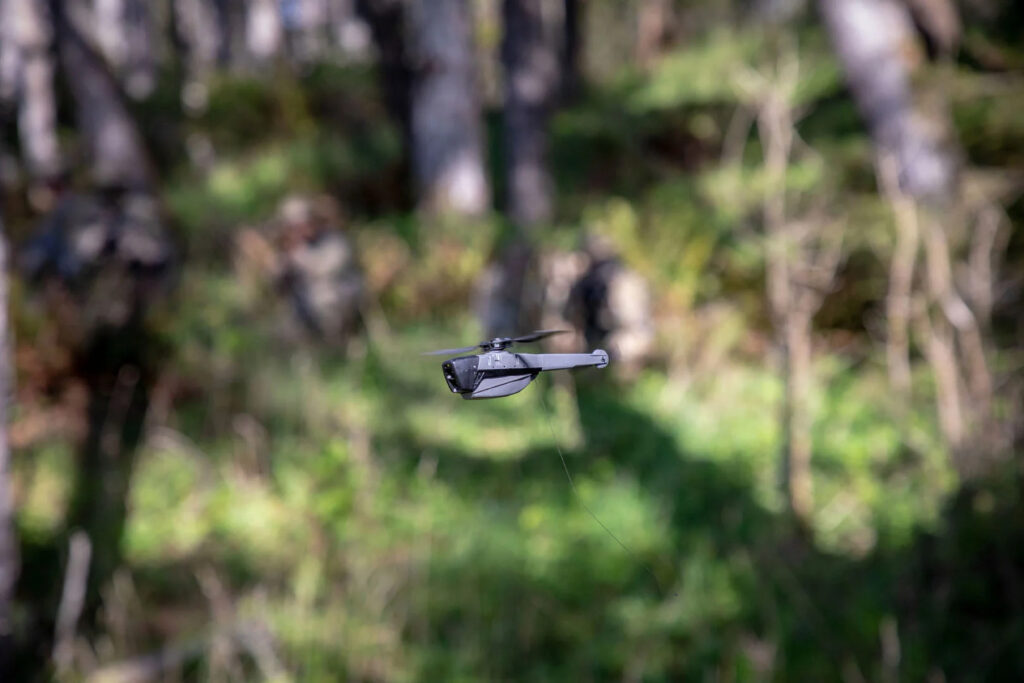 Black Hornet 4 nano drone hovering in a tactical environment