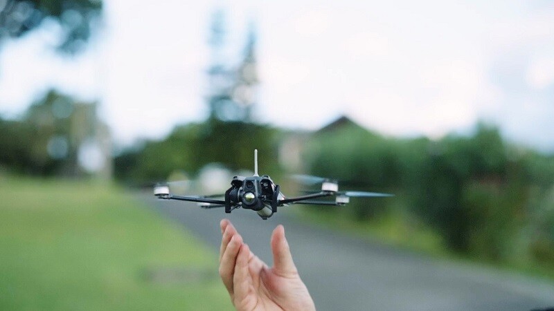 Nano drones taking a flight from the palm of a hand