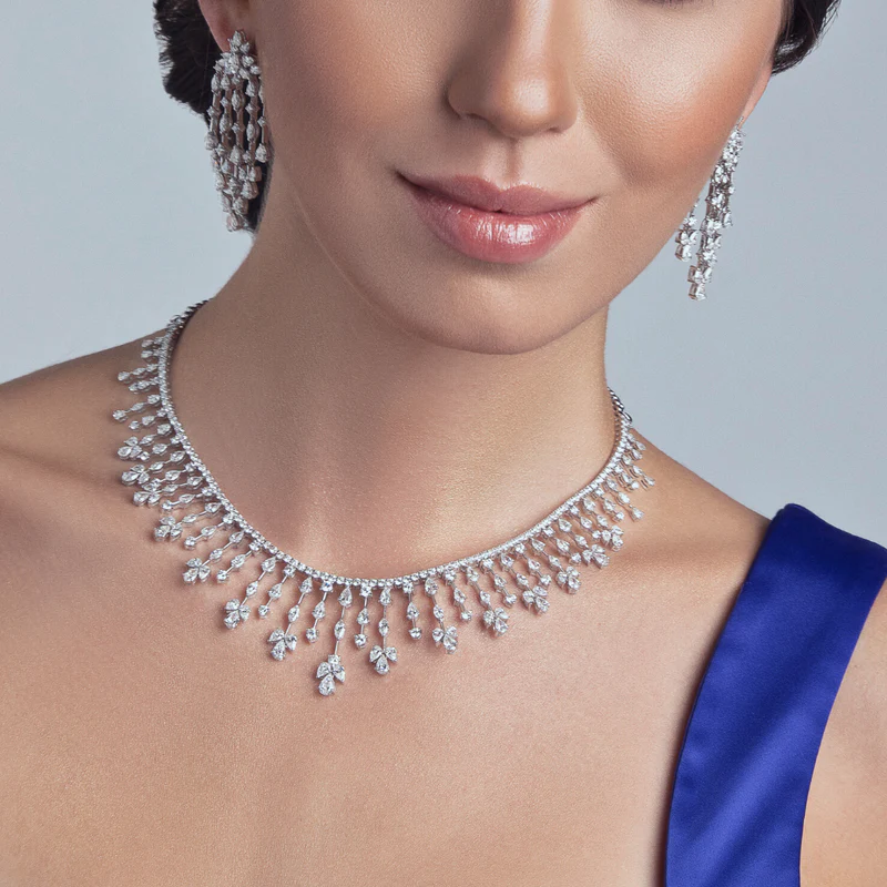Pretty model wearing a white diamond necklace in 14k white gold