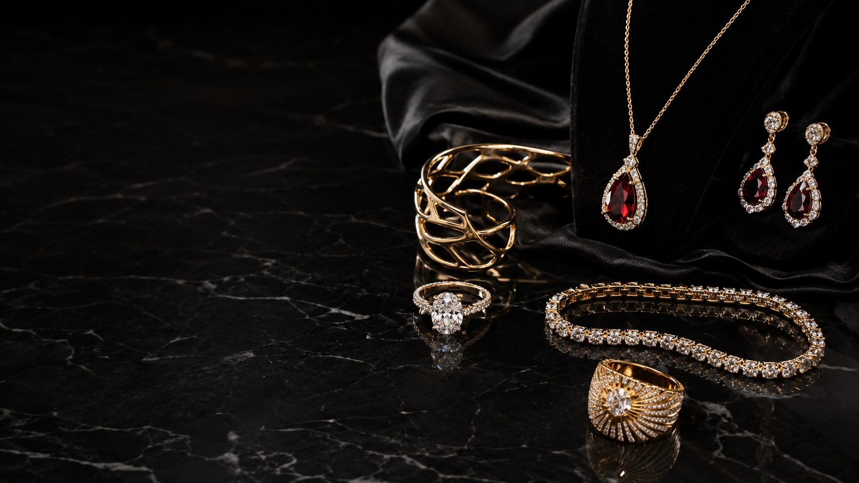 Luxury jewelry collection featuring a ruby pendant necklace, matching earrings, diamond rings, a gold cuff and a diamond tennis bracelet.